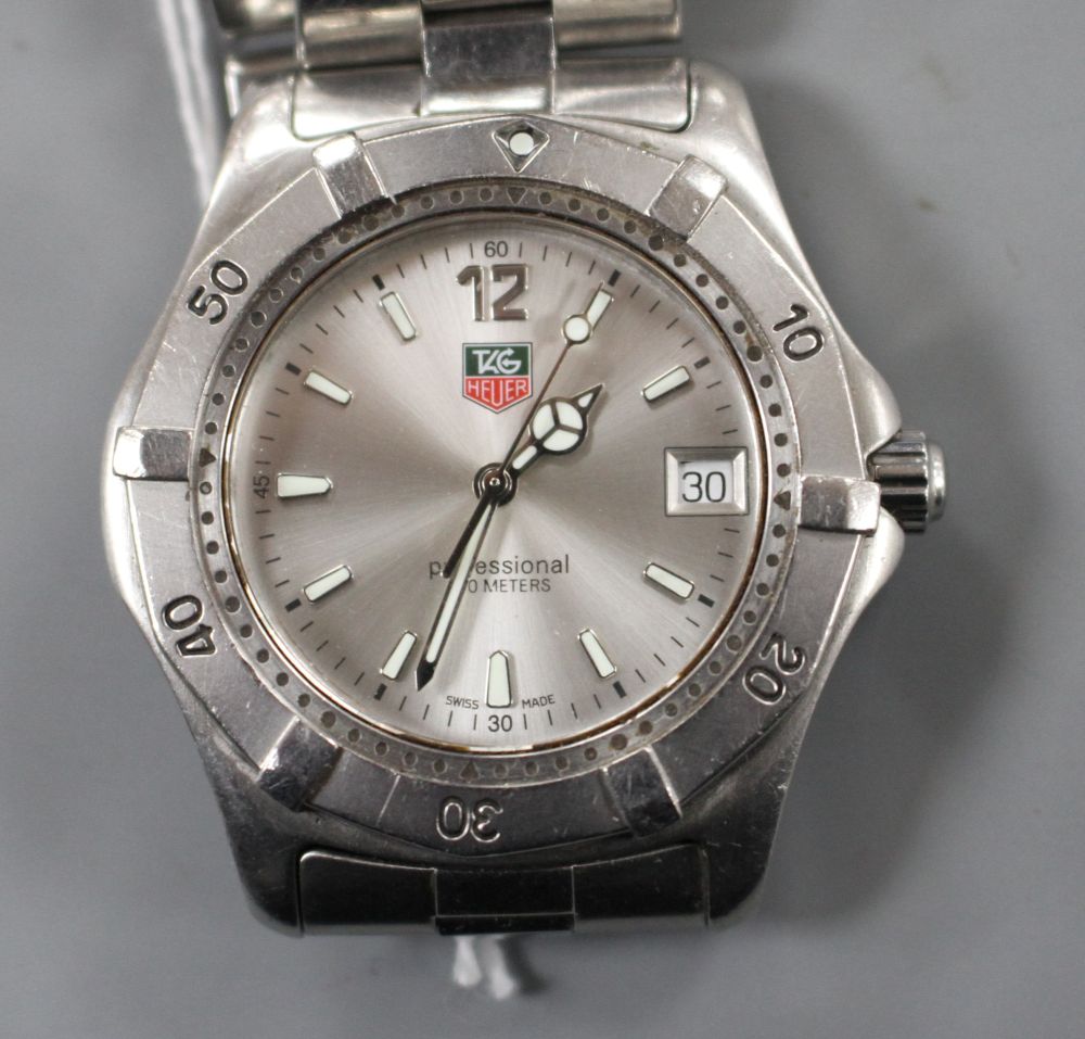 A gentlemans stainless steel Tag Heuer Professional quartz wrist watch, on steel Tag bracelet.